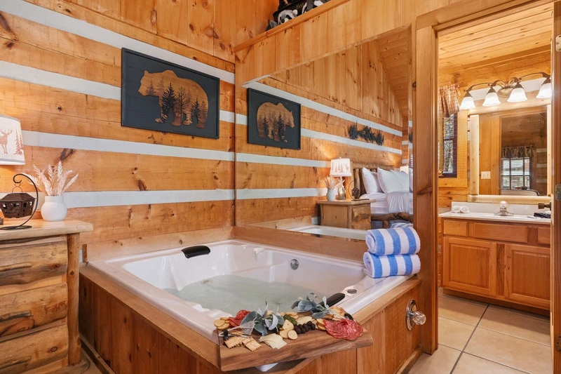 In-cabin jetted whirlpool tub beside the bed