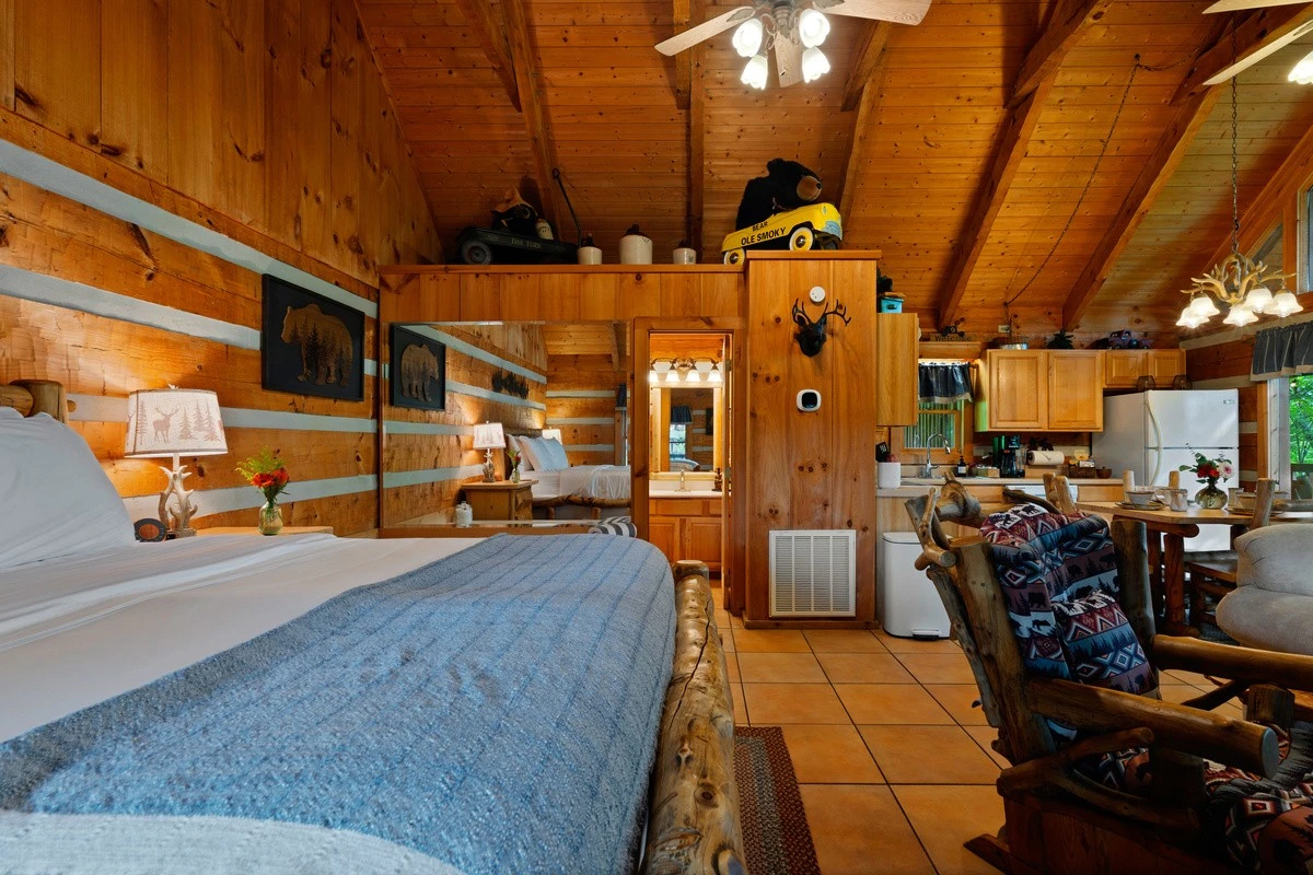 Queen log bed in the Nestled Oaks studio