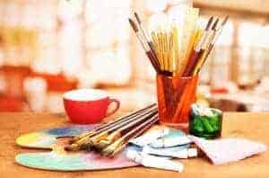 Pencils, brushes, and watercolor for arts and crafts