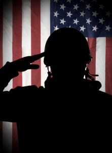 Soldier saluting American flag