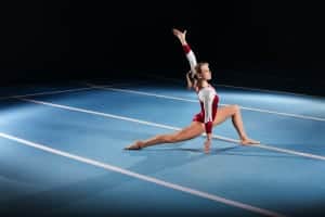 Young gymnast competing in the stadium