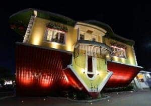 Upside down house at night