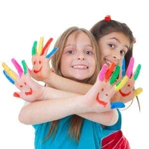 Children with painted fingers for arts and crafts