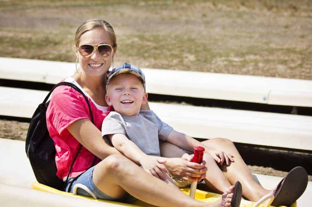 Mother and son riding on the Smoky Mountain Alpine Coaster in Wears Valley