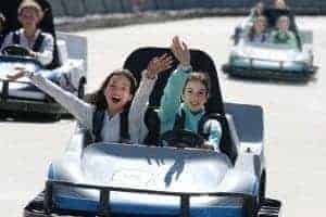 Two happy girls in go kart