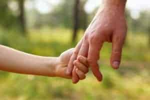 father and son holding hands during Smoky Mountain vacation