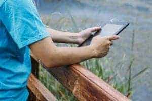 man holding ipad during Smoky Mountain vacation