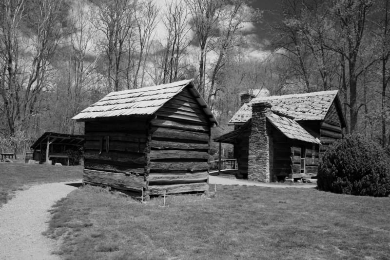 Black and white images of wood cabins in the Smoky Mountains