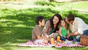 Family having a picnic outside