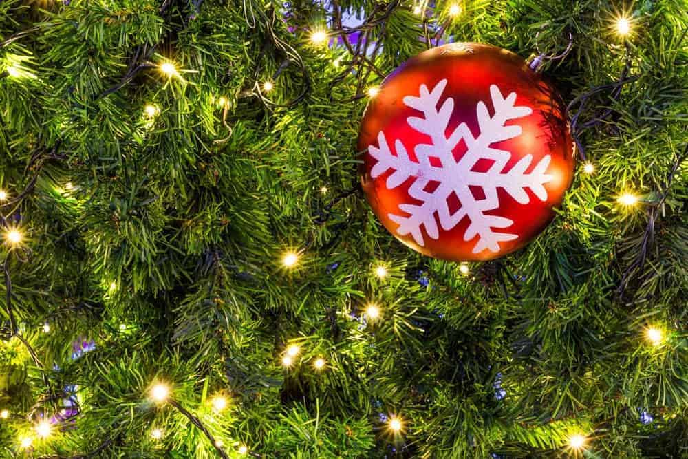 Christmas tree with a red ball ornament with a snowflake