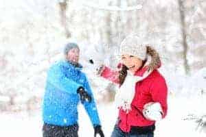 couple enjoying a snowball fight in the Smoky Mountains