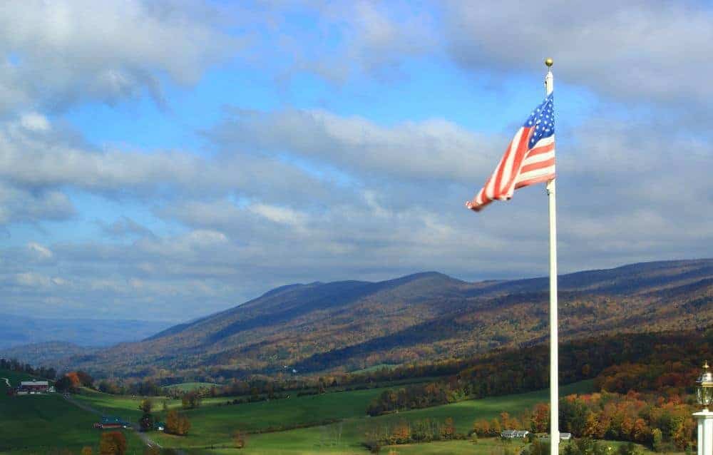 American flag with the Smoky Mountains in the background