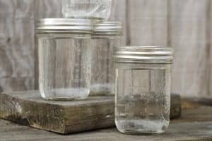 Clear mason jars of moonshine