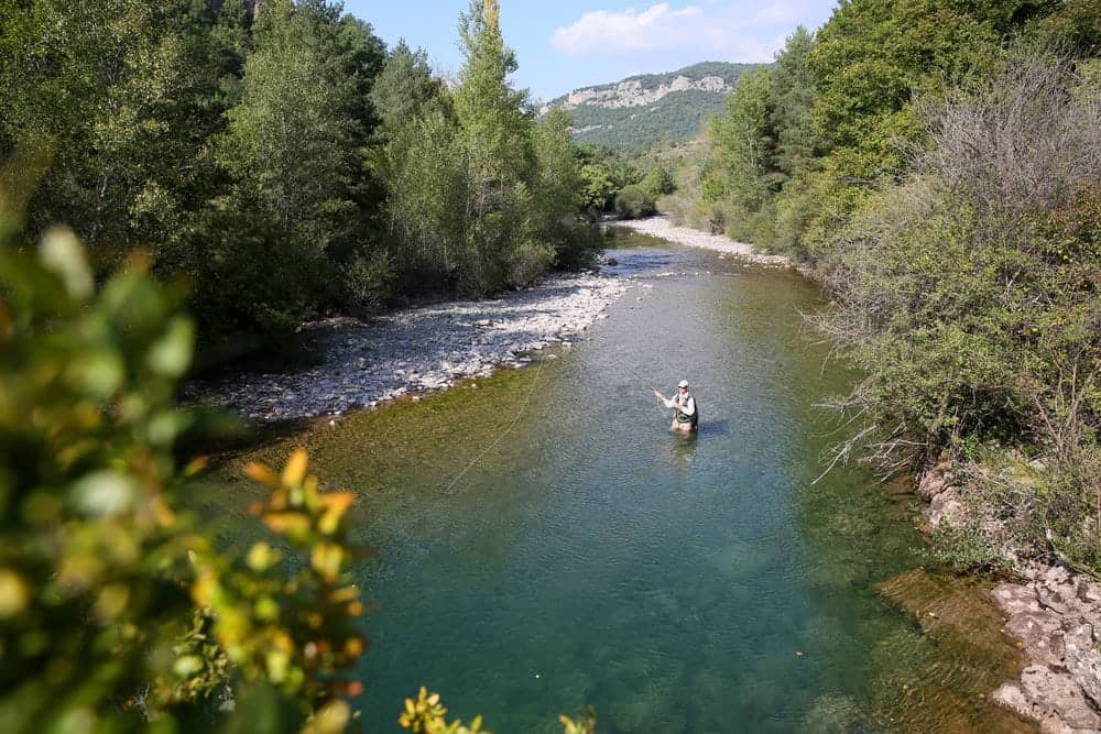 Angler casting rod while Gatlinburg stream fishing