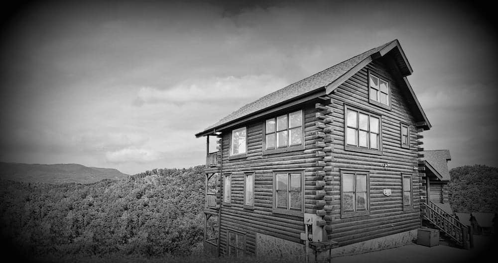 Black and white image of a Pigeon Forge or Gatlinburg cabin.