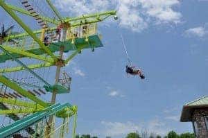 Man riding on new ropes course attraction at The Island