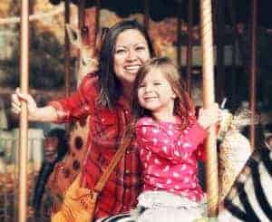 Mother and daughter riding on a carousel at Dollywood