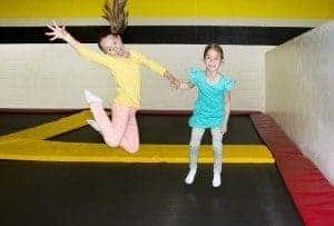 Sisters having fun at a trampoline park, one of the best indoor things to do in Pigeon Forge.