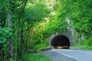 Car driving through a tunnel near the Great Smoky Mountains National Park visitor center.