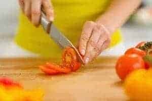 Chopping tomatoes with a knife from Smoky Mountain Knife Works.
