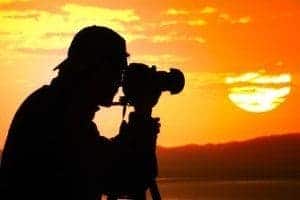 man taking pictures of the Smoky Mountains with a tripod