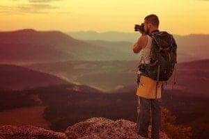 person taking pictures of the Smoky Mountains