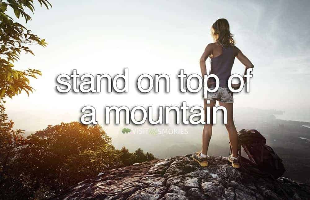 woman standing on top of a mountain in the Smoky Mountains