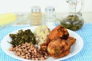 A plate of fried chicken and other tasty Southern foods.