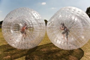 Two kids enjoying Zorb Smoky Mountains at the Outdoor Gravity Park Pigeon Forge.
