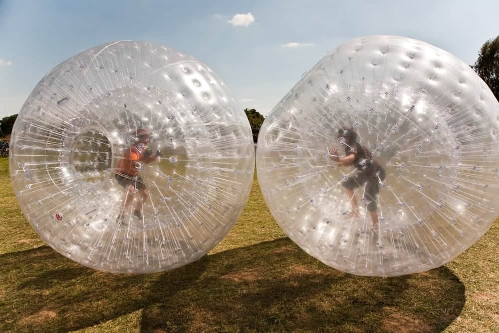 Two kids enjoying Zorb Smoky Mountains at the Outdoor Gravity Park Pigeon Forge.
