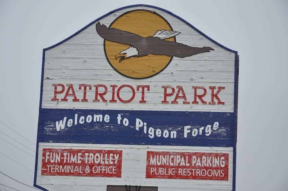 The Patriot Park sign in front of the station where they have a Pigeon Forge trolley map.