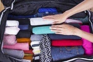 Woman packing for vacation to the Smoky Mountains