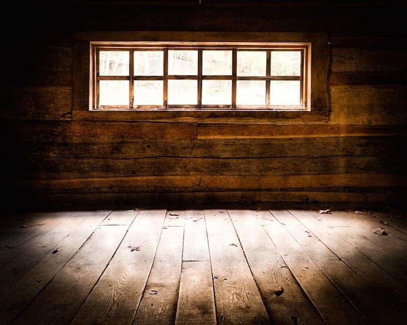 Light shining through a window at the historic Ogle Cabin.