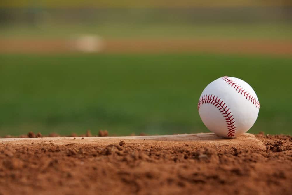A baseball on a pitcher's mound.
