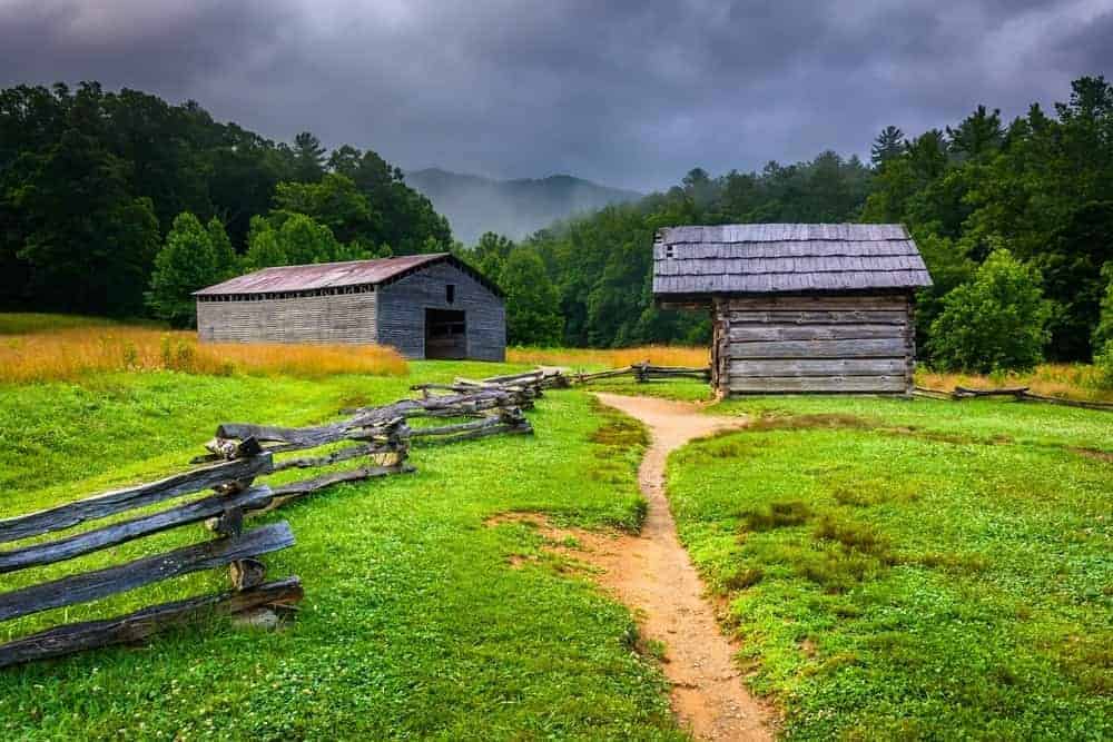 A barn and a log cabin in Cades Cove.