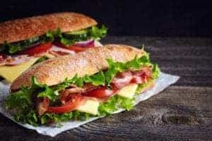 Two submarine sandwiches.