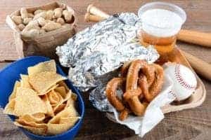 A tray of ballpark food and baseball memorabilia.