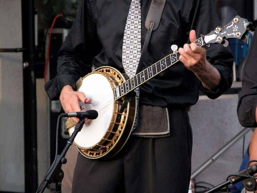 A banjo player on stage.