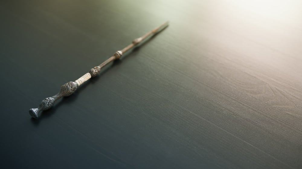 A magic wand on a wooden table.