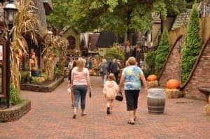 A family walking through The Village in downtown Gatlinburg.