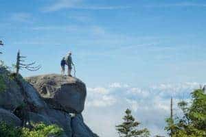 Father and son on a large rock in the Smoky Mountains.