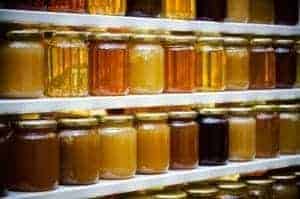 Jars of honey in a shop.