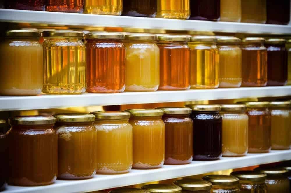 Jars of honey in a shop.