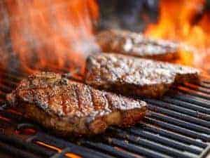 Delicious steaks on the grill.