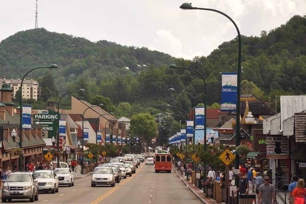 Cars and vacationers in downtown Gatlinburg TN.