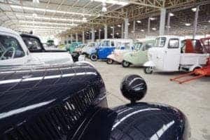 Classic vehicles in a car museum.