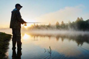 man fishing in a lake