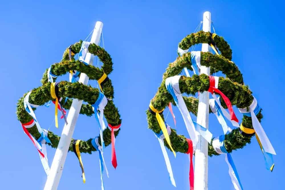 Two German maypoles at Maifest.