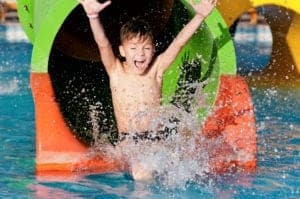 boy on water slide during summer in gatlinburg