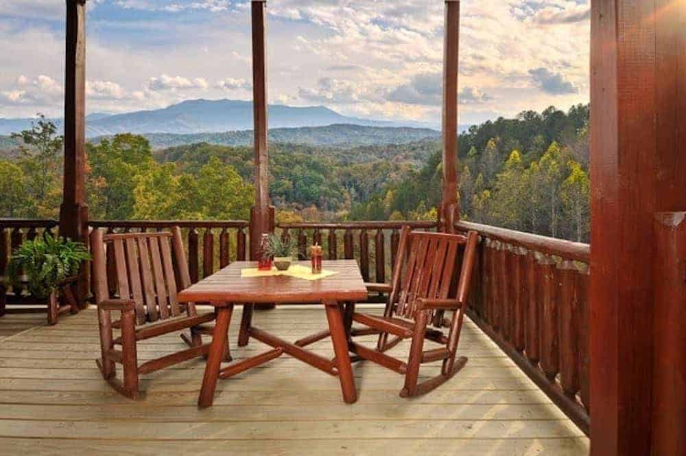 Chairs-sitting-on-the-deck-of-a-cabin-rental-in-Pigeon-Forge-with-mountain-views